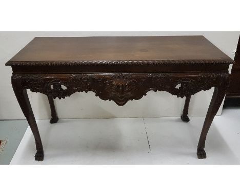 Irish mahogany Chippendale rectangular shaped side table with roped edge top over mask front, carved floral detail, on paw fe