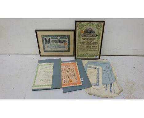 2 bundles of original old share certificates (spent), mainly English companies, also 2 framed certs - Monpre Mining Company &