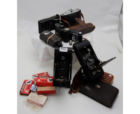 German WW” Daimon flashlight, Goldi folding camera, Agfa Isolette 1 folding camera, Kodak pocket camera No 1A, Eastman Kodak 