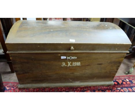 Large wooden trunk, with a domed top, from the sister ship to the Titanic, stamped AK 1910, with carrying handles, 37”w x 25”