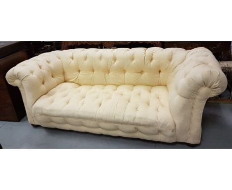 Large Victorian Chesterfield sofa, yellow satin fabric with buttoned in detail, on round bun feet (cut down), 84"w x 36"d