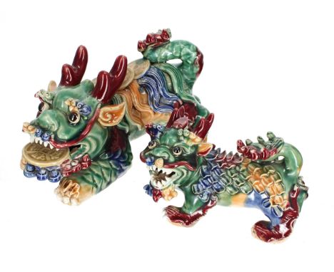 Two similar Chinese porcelain Dog of Fo figures, polychrome decorated with moulded applied facial and scale details, 20th cen