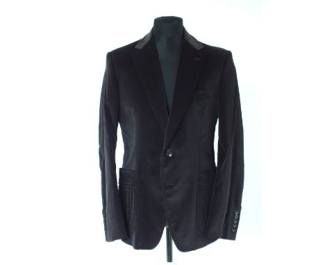 A Gucci jacket, grey, patch pockets with inverted pleat detail, belt waist detail to the back, lined in dark brown with Gucci