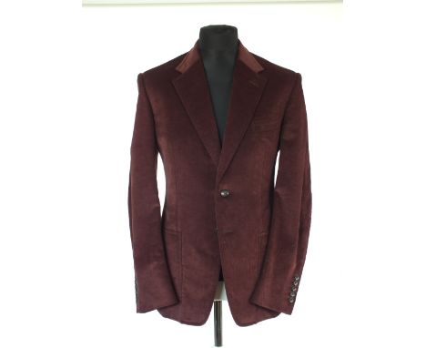 A Gucci jacket, burgundy, patch pockets, single vent, lined, needle cord jacket, Italian size 52 regular, 73% cotton, 25% mod