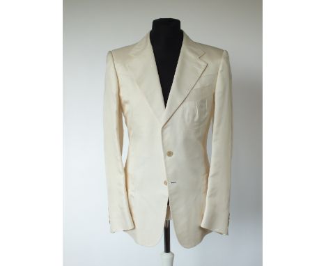 A Gucci jacket, cream, lined, single vent, patch pockets with pleating detailing, front and back yoke, waist detail to the ba