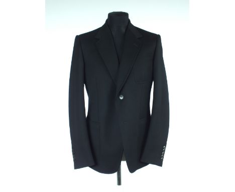 A Gucci jacket, black, patch pockets, lined with Gucci belt print lining, single vent, Italian size  54R, 100% wool