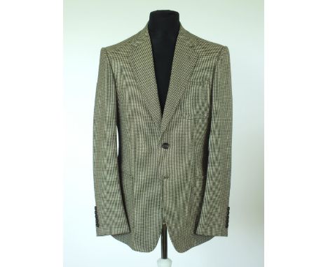 A Gucci jacket, brown dogs tooth check, double vent, lined, patch pockets, Italian size 50R, 90% wool, 10% mohair