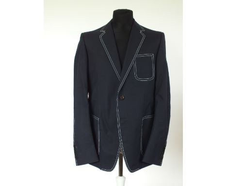 A Gucci jacket, navy, lightweight, contrast white stitching detail, patch pockets, brown buttons, striped cotton half lining,