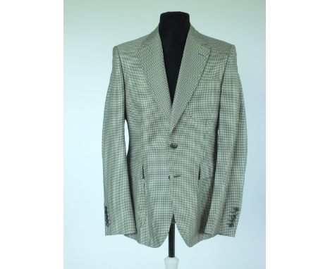 A Gucci sports jacket, mid grey dogs tooth check, patch breast pocket, single vent, half lined in black, lining is woven with