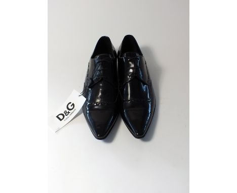 A pair of Dolce & Gabbana evening shoe, black patent leather, swing ticket attached,EU 42