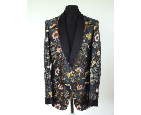 A Louis Vuitton brocade evening jacket, navy blue, lined, single vent, Italian size 52, 89% silk, 11% cotton
Note:
This jacke