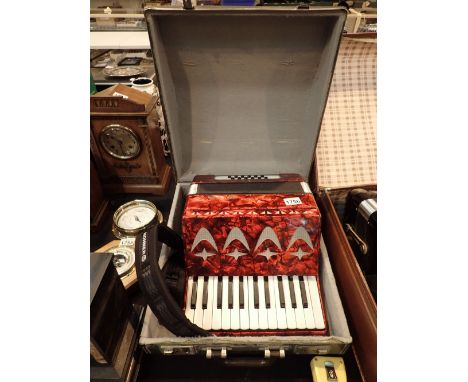 Cased two octave twelve button accordian