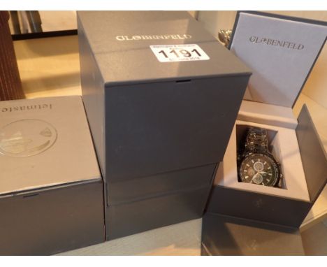 New old stock four boxed Globenfeld wristwatches on rubber or ceramic straps