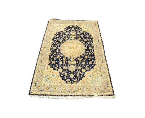TABRIZ, PERSIAN, SMALL CARPET WITH MIDNIGHT BLUE FIELD, with large scolloped circular centre medallion with pendants and span