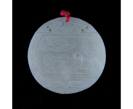 A Chinese Carved Light Celadon Jade Circular Pendant. Birds in nature with archaic patterns. Good condition. Measures 1-7/8" 