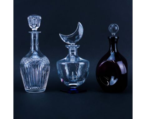 Grouping of Three (3) Vintage Decanters. Includes: Hawkes crystal, Sevres crystal, and amethyst glass. Hawkes and Sevres deca