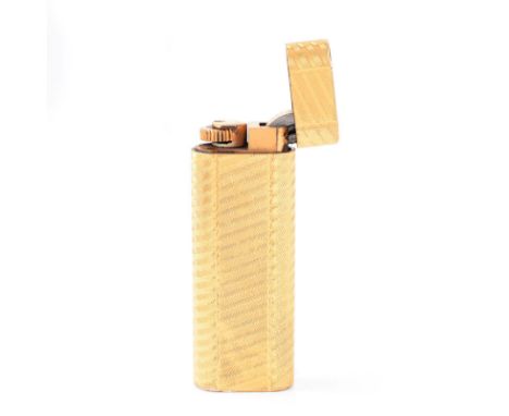 Vintage Cartier Gold Plated Butane Lighter. Signed. Normal surface wear. Measures 2-3/4" H, 1" W. Approx. weight: 82.2 grams.