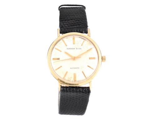 Man's Vintage Tiffany & Co 14 Karat Yellow Gold Automatic Movement Watch with Lizard Strap, Stamped 14K. Case measures 33mm. 