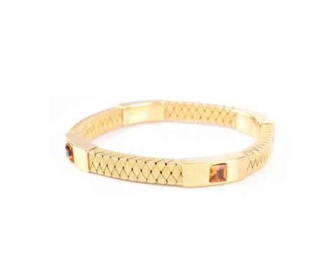 Italian 18 Karat Yellow Gold and Square Cut Citrine Flexible Bangle Bracelet. Stamped Italy, 18K. Very good condition. Measur