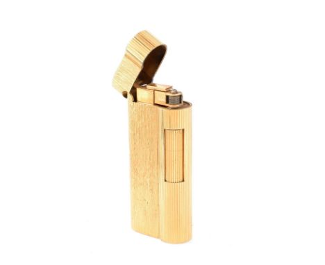 Vintage Dunhill Gold Plated Butane Lighter. Signed. Normal surface wear. Measures 2-9/16" H, 1-1/8" W. Approx. weight: 82.7 g