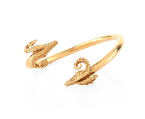 Vintage 18 Karat Yellow Gold Rams Head Bangle Bracelet. Stamped 750 18K. Very good vintage condition. Measures 5/8" W, 2-1/8"