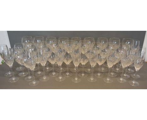 A Large Stuart Crystal Drinking Set comprising wine glasses, champagne glasses and others 