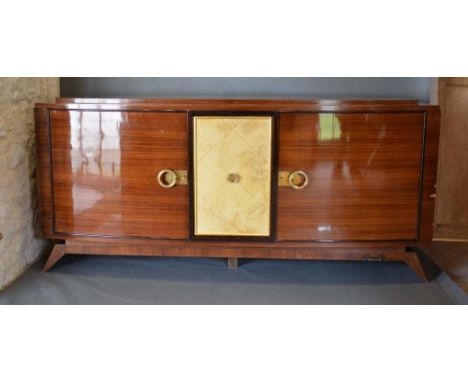 An Art Deco Large Bow Fronted Side Cabinet, the stepped top above central panel door enclosing drawers and shelves, flanked b