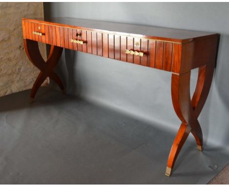 An Art Deco Large Console Table, the three frieze drawers with brass handles and escutcheons, raised upon shaped end supports