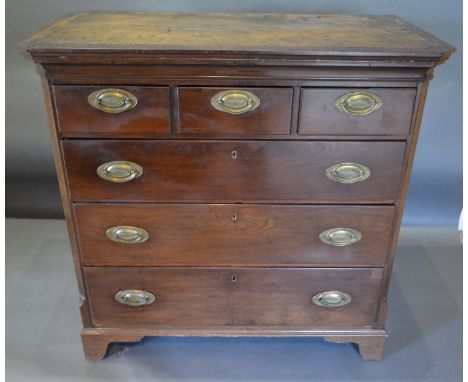 A 19th Century Mahogany Chest of Drawers, the moulded top above three short and long drawers with oval brass handles raised u