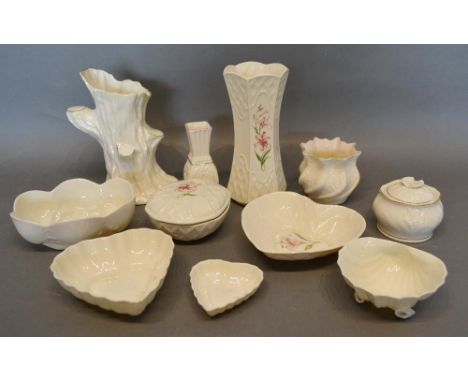 A Belleek Tree Stump Vase, together with three other Belleek vases, five small Belleek bowls and two Belleek boxes 