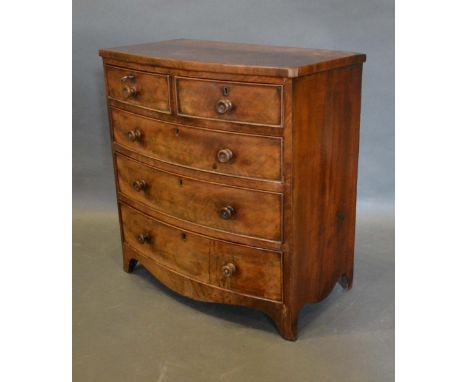 A 19th Century Miniature Apprentice Mahogany Bow-Fronted Chest of two short and three long drawers with knob handles above a 