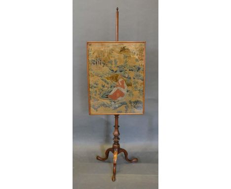 A 19th Century Mahogany Pole Screen with Berlin tapestry panel with a turned centre column and tripod supports 