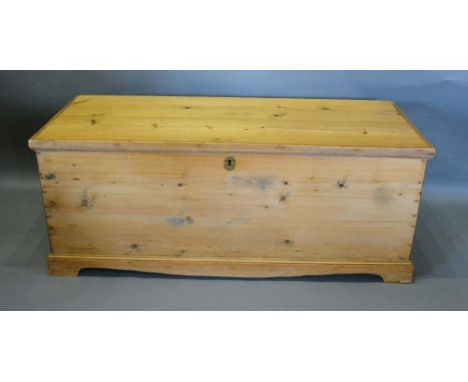 A Pine Blanket Chest, the hinged top above bracket feet, 119cm wide, 45cm deep, 48cm high 