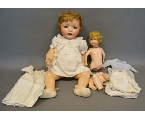 A Simon &amp; Halbig Bisque Head Doll, no.9, with jointed limbs and body, together with another German bisque head doll 