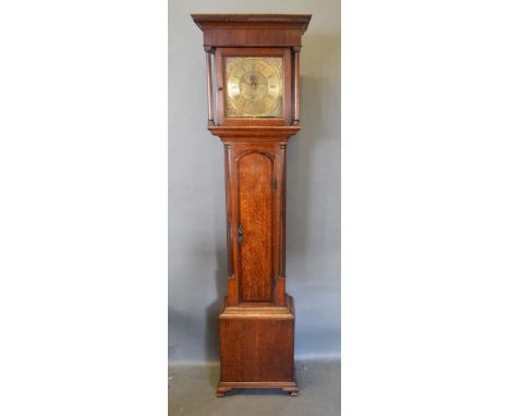 A George III Oak and Mahogany Longcase Clock, the square hood with turned pilasters above an arched door flanked by quarter p