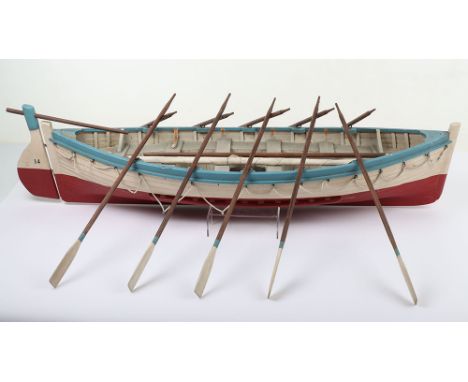 Scale Model of Lifeboat No. 14 from the Titanic, complete with 10 oars, two water barrels,  light blue/red/white wooden model