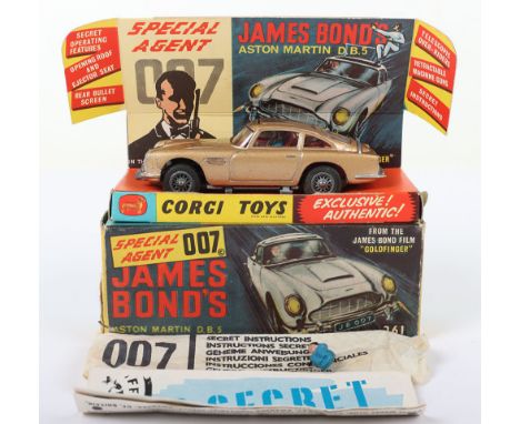 Corgi Toys 261 James Bond Aston Martin D.B.5 from the Film “Goldfinger” gold body, with working ejector seat, rear bullet scr