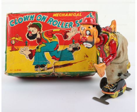 T.P.S (Japan) tinplate Clown on Roller Skates clockwork toy, 1950s, lithographed in vaqrious bright colours, light blue mater