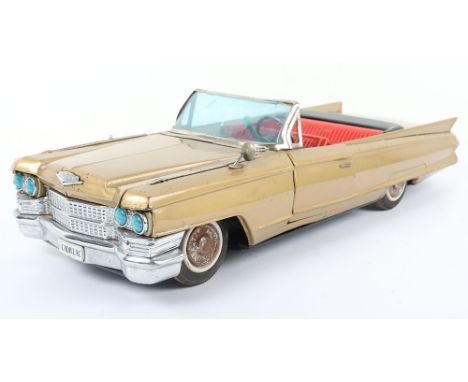 Large Bandai battery operated Golden Cadillac Convertible, 1960s, finished in gold with chrome bumpers, hinged doors and boot