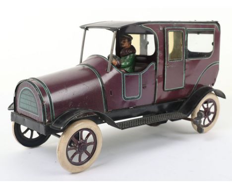 Tinplate clockwork Chauffer Driven Limousine, German circa 1912, finished in mauve with light blue and black lining, lithogra