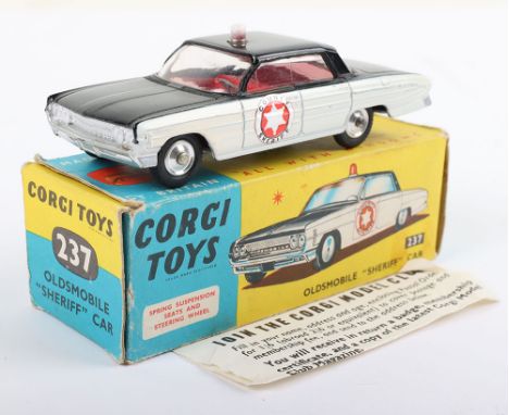 Corgi Toys 237 Oldsmobile Sheriff’s Car, black/white with County Sheriff door labels, red interior, spun shaped wheel hubs, i