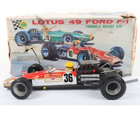 Original Junior Products (Japan) tinplate battery operated Lotus 49 Ford F-1 Racing car, 1970s, finished in red, white and go