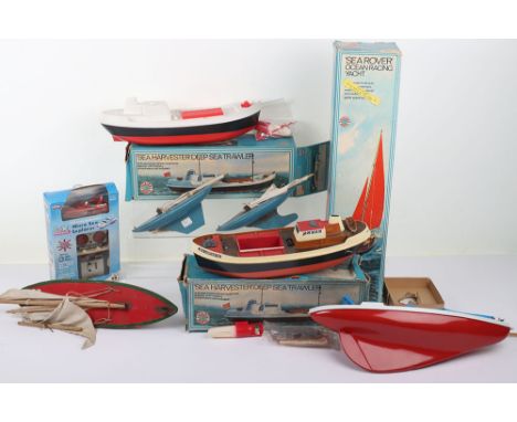 Tri-ang Scalex Boats Sea Rover Ocean Racing Yacht, red/white plastic body, blue sails, complete plastic Tri-ang display stand