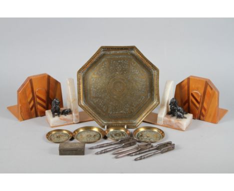 An Indian engraved brass octagonal tray and smaller similar pin trays, three nut cracks, a Bell &amp; Co New Zealand vesta bo