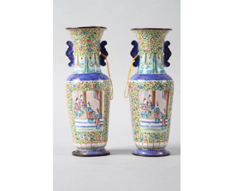 A pair of Chinese Canton enamel cloisonne vases with panels decorated figures on a floral pattern yellow ground, 7 1/2" high 