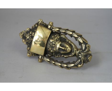 A 19th century door knocker, 8 1/2" high 