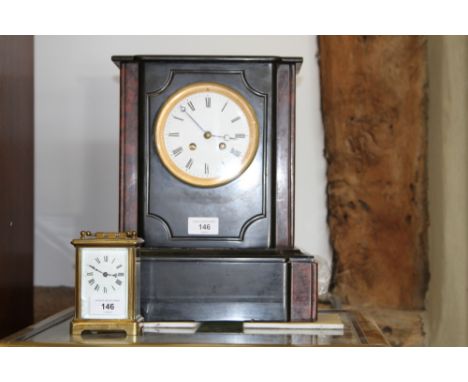 A 19th century slate and marble mantel clock with striking movement and white enamel dial, and a 19th century brass cased car