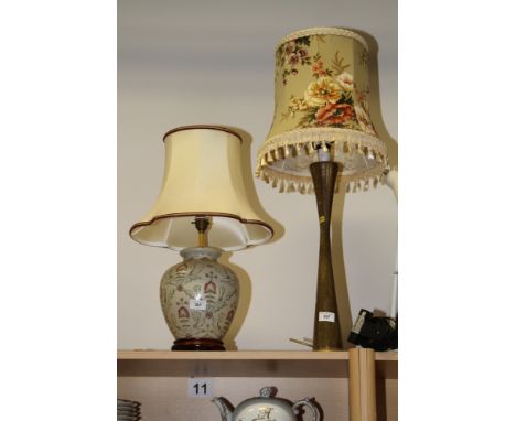 A brass table lamp with engraved decoration, 20" high, and a ceramic baluster table lamp with floral decoration, 13" high