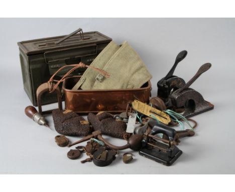 A gun cleaning kit, two embossing punches, a copper planter and various other objects 