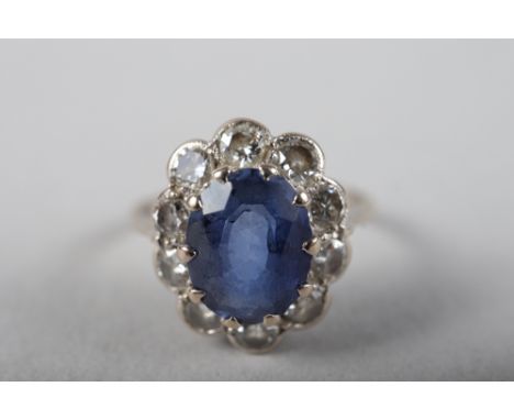 An 18ct gold, platinum, diamond and blue stone cluster ring, size M/N, 3.2g